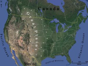 Carte satellite de l'Amérique du Nord mettant en évidence la région des Grandes Plaines (Great Plains), vaste zone semi-aride s'étendant du Canada au Texas entre les Rocheuses et le Mississippi, avec les frontières des États américains et canadiens.